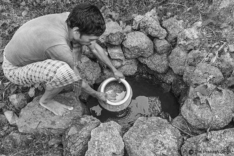 Optimizing traditional drinking water sources for accelerating change - ‘Chua’ (spring-based water source) being used for collecting drinking water in Paharia Tola, village Jhajhapara, district Dumka, Jharkhand